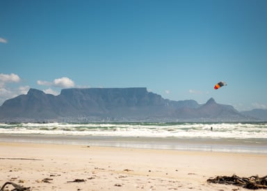 Big Bay Beach Views to Table Top mountain with single kiter in the water