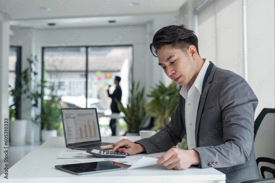 Small business owner working through startup costs and pricing