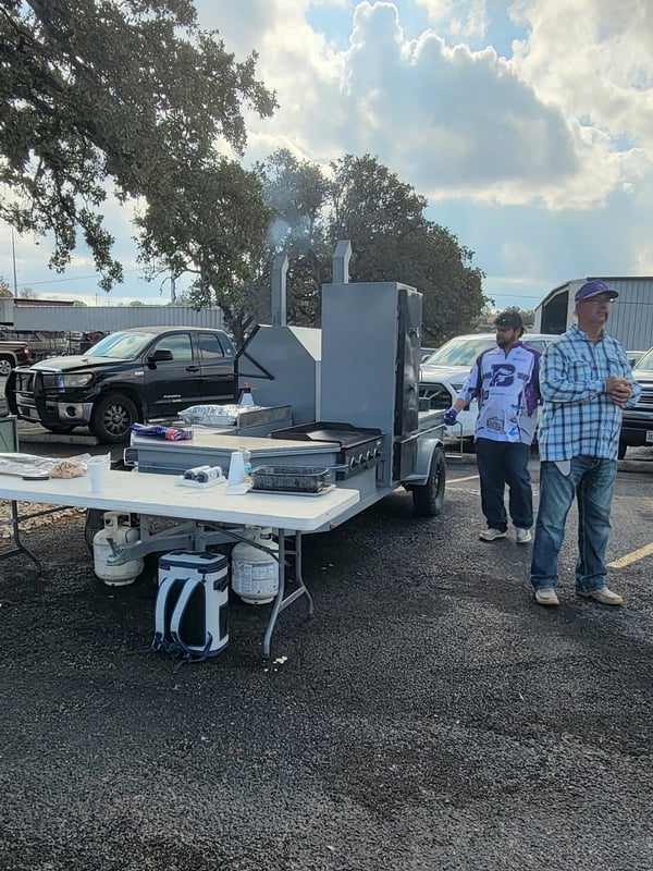 Catering grill and team at a fishing tournament