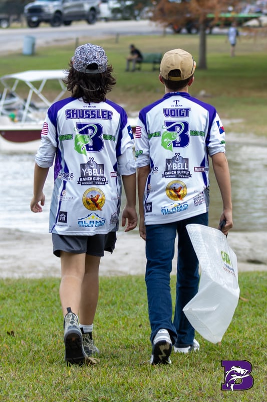 Clint Voigt, Boerne Bass Club boat captain, presenting bass at FAN tournament weigh-in, Boerne Texas