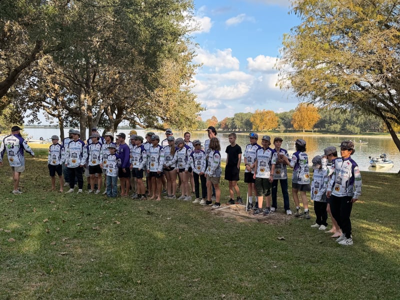 Group of youth anglers in jerseys at a fishing tournament