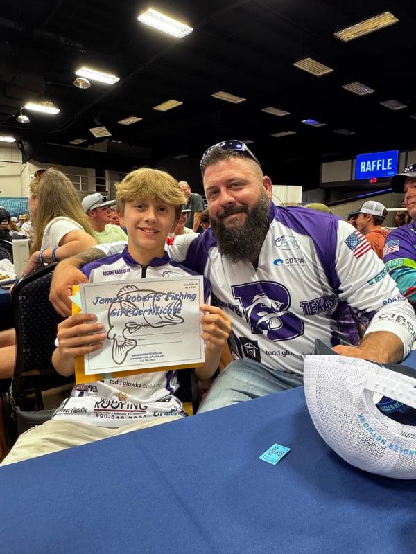 Participants at the Boerne Bass Club fishing tournament holding a certificate.