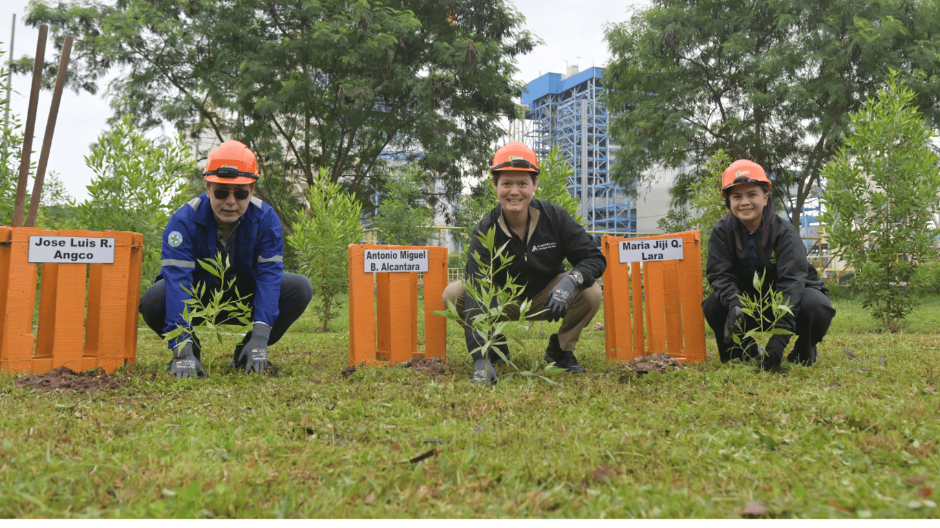 Alsons Power Group executives—Chief Executive Officer Antonio Miguel B. Alcantara (center), Senior Vice President for Generation Jose Luis R. Angco (left), and Vice President for Corporate Services Maria Jiji G. Lara (right)—lead the tree planting activity at Sarangani Energy Corporation in Maasim, Sarangani, as part of the Group’s We Power with Care Day celebration.