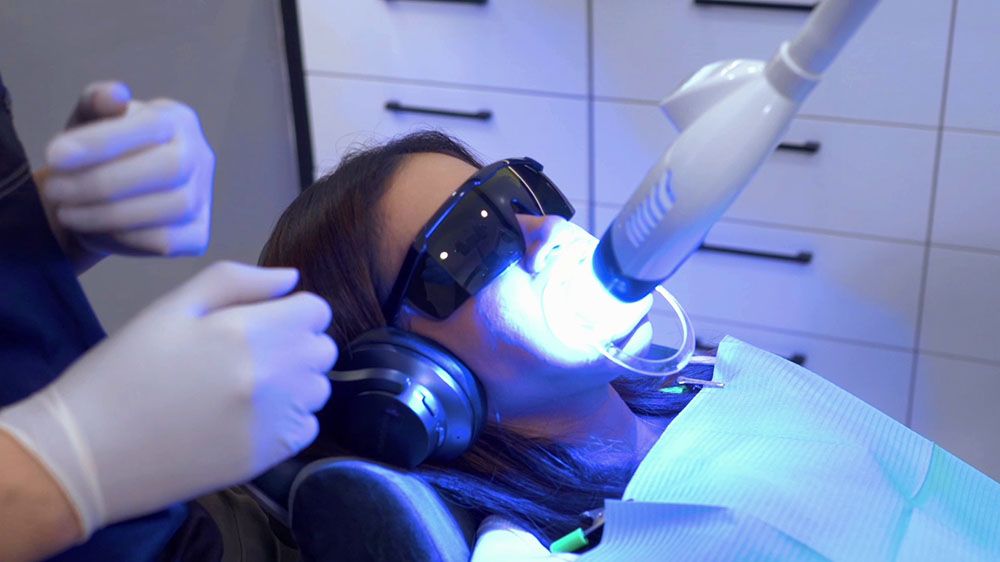 The use of a laser to whiten teeth in the clinic