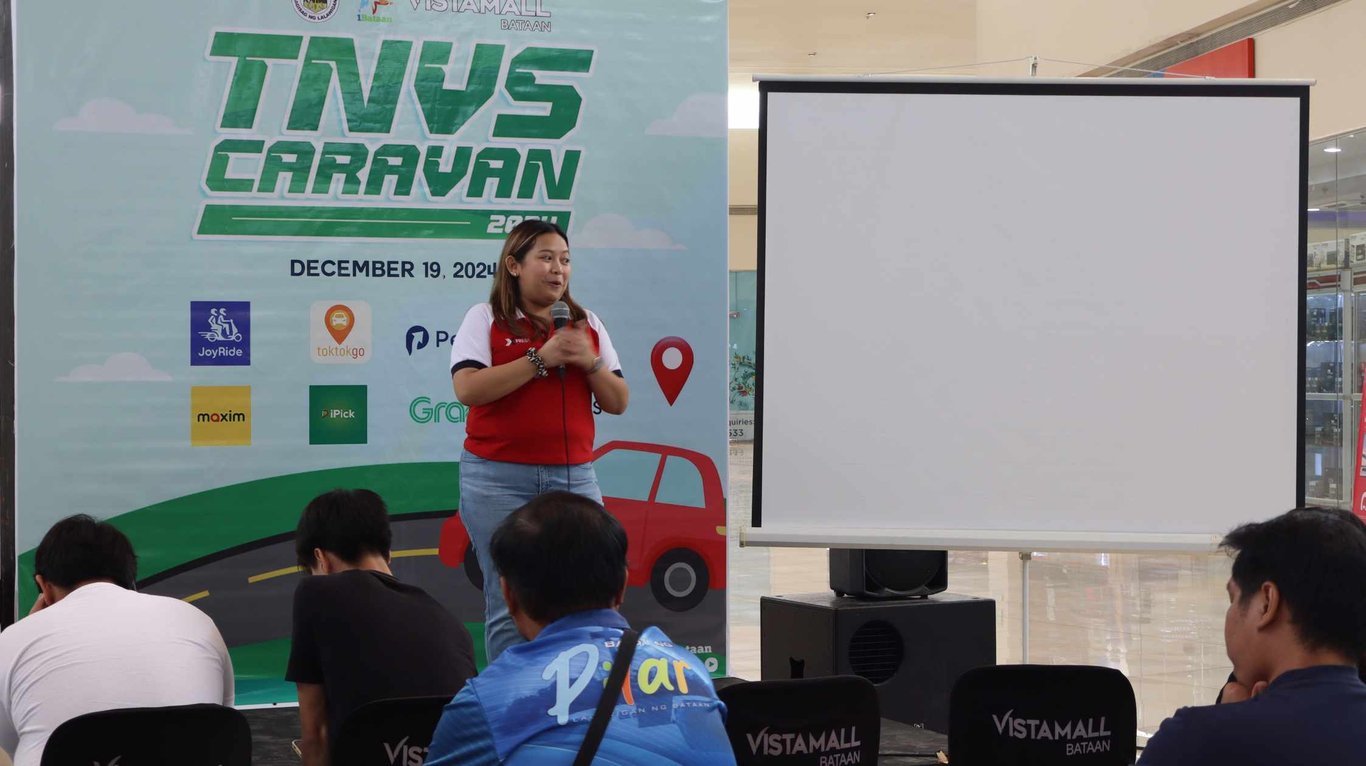 Xpress team Ms. Alyssa Duldulao speaking at the recent TNVS event in Vista Mall Bataan