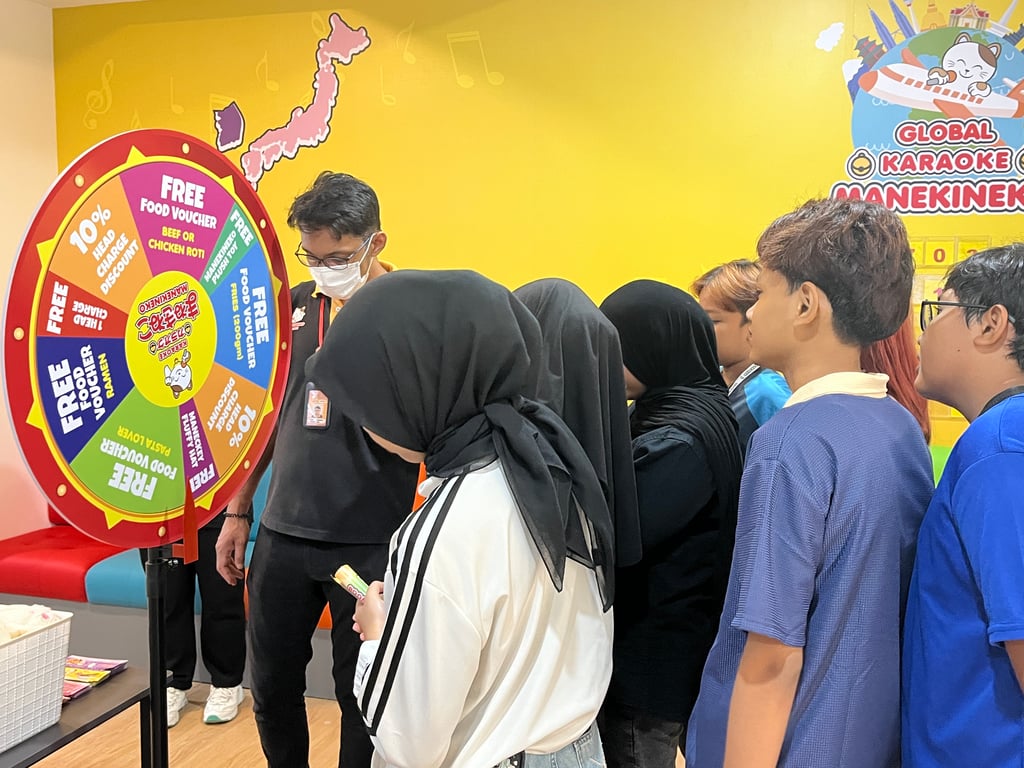 Customers taking part in lucky wheel.