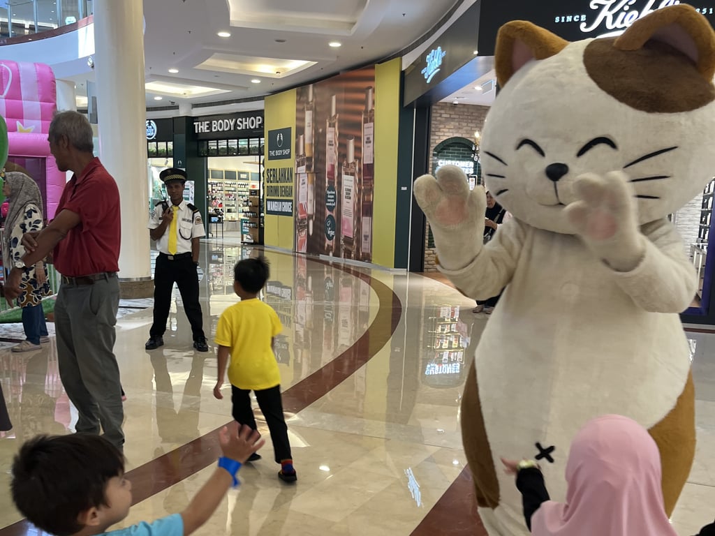 Manecky greeting mall guests