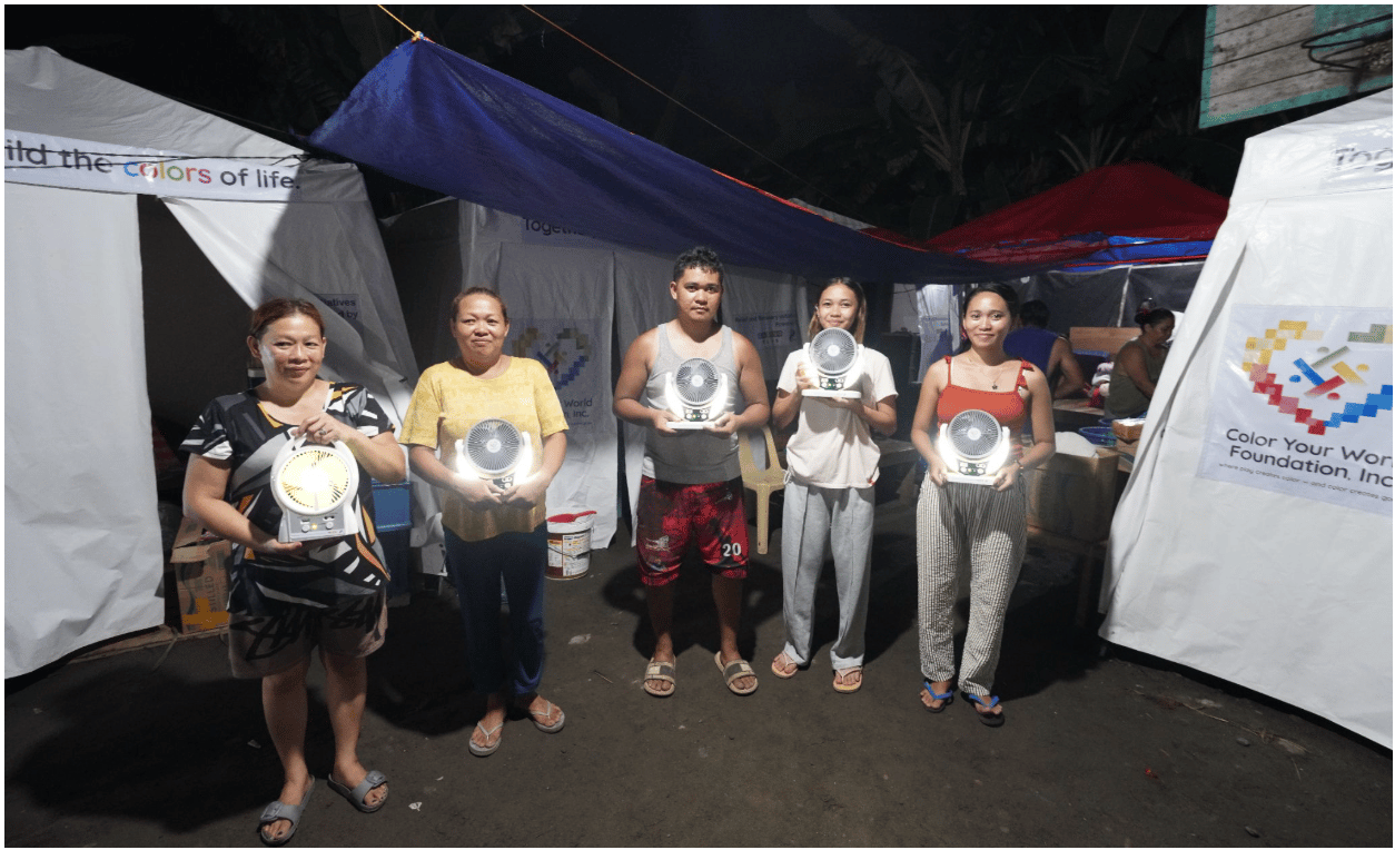 Residents in Purok 20, Barangay Lagao in General Santos CIty show the solar-powered lamps they received from Color Your World Foundation on June 24, 2026.