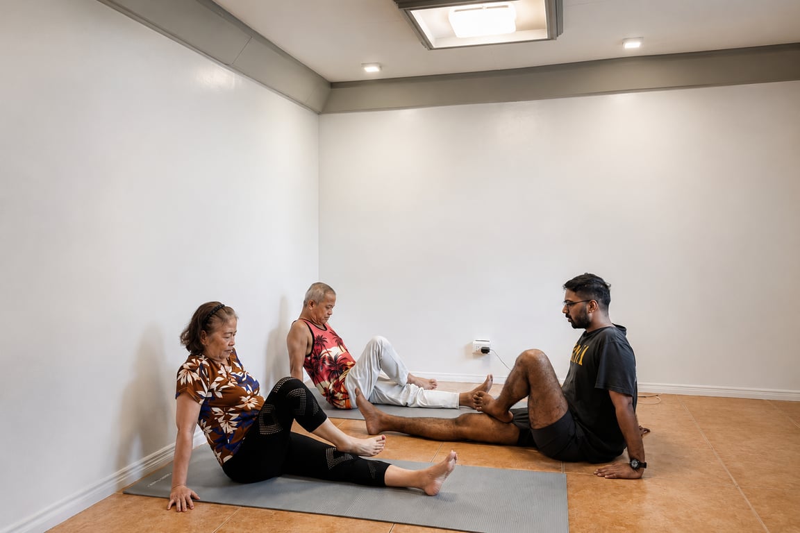 Older adults practice guided floor-based movements.