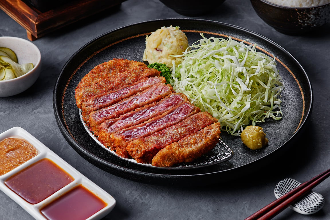 Gyukatsu Signature Set featuring crispy beef cutlet, fresh cabbage, and traditional Japanese sides.