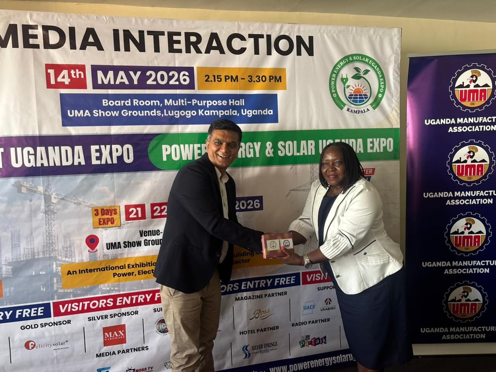 Mr. Trushar Upadhyay, Sr. Advisor, Advisory Board – Power, Energy & Solar Uganda Expo and Construct Uganda Expo, presenting a Token of Appreciation to Jacinta Nekesa Nangabo, Executive Director, Environmental Alert and Secretariat for Renewable Energy Civil Society Organizations Network (RECSO)