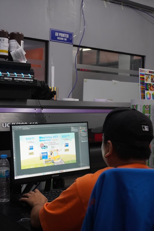 Bescost Employee Designing Promotional Graphics