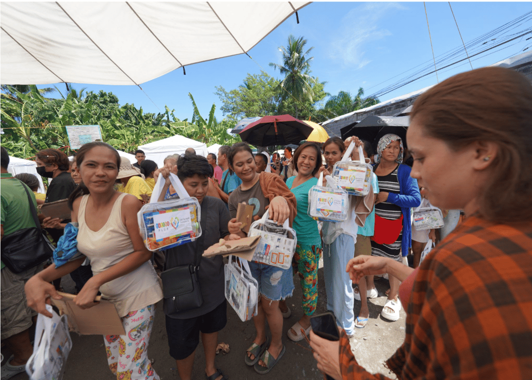 Residents from Barangay Lagao in General Santos City receive the medicine and hygiene kits from Casino Plus and Color Your World Foundation on June 14, 2026.