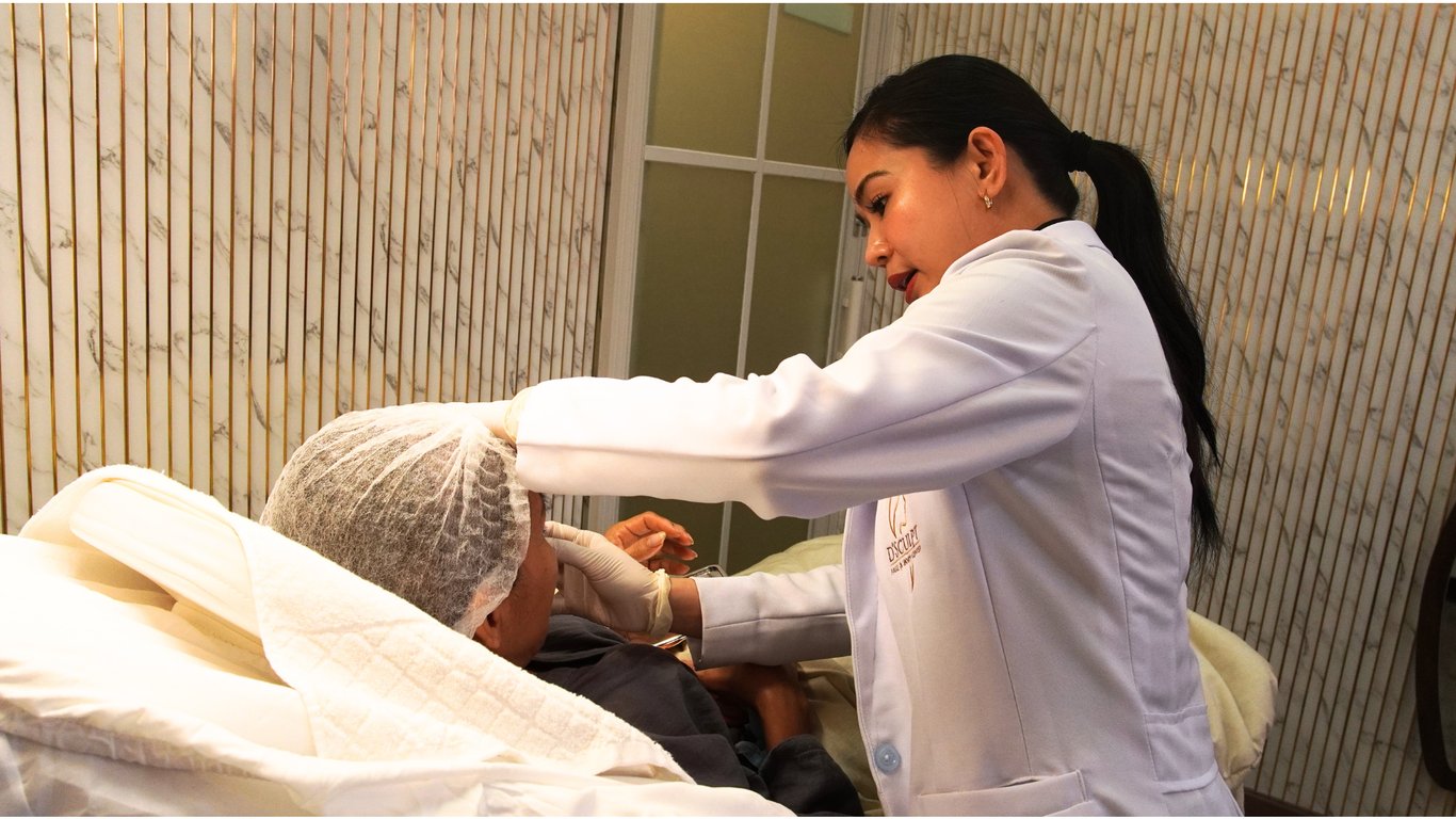 Dr. Donna assesses a patient's nasal features to help determine the most appropriate approach to rhinoplasty.