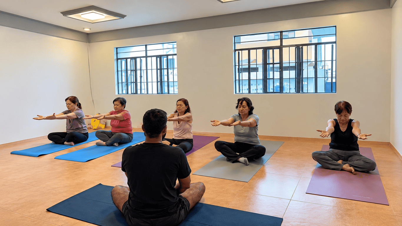 Students participate in a guided yoga session combining gentle movements with mindful breathing and relaxation.