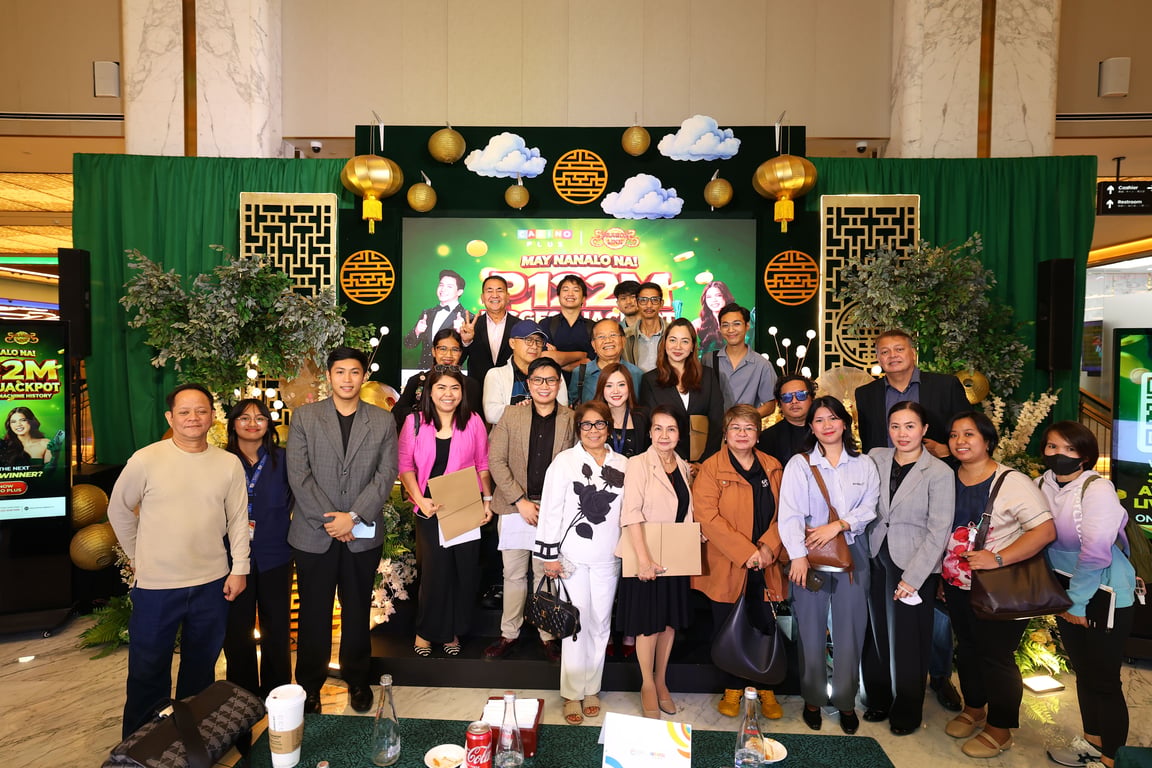 Corporate&nbsp;ommunications Director Joanna Christina Tinio (center right) and Assistant Corporate Communicatons Manager Job Manahan (center left) pose with members of the media during the ceremonial jackpot turnover on Sept. 9, 2026.