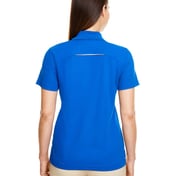 Back view of Women’s Radiant Performance Piquéé Polo With Reflective Piping