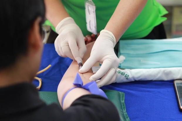 nurse taking blood