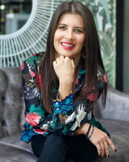 A seated brunette woman.