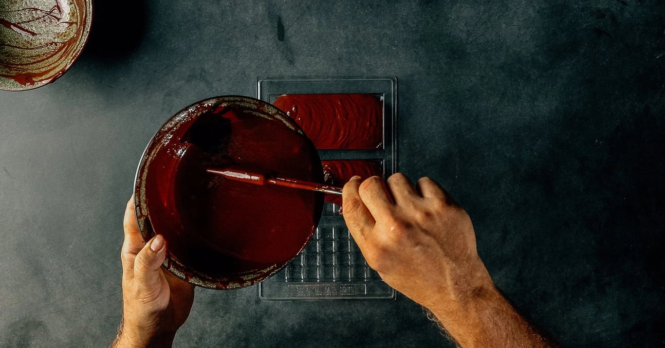 Chocolate pouring into a mold