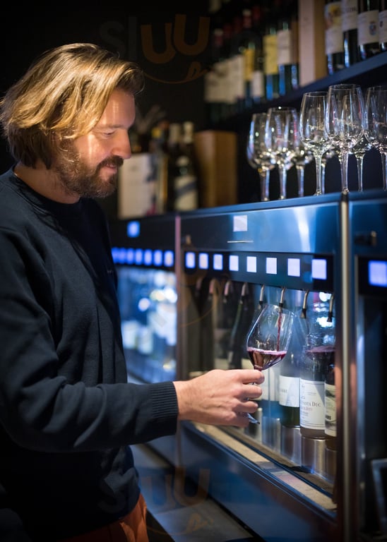 Photo of a wine bar in Bordeaux featuring a self-service wine machine.