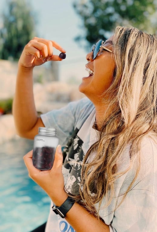 Customer holding mushroom gummies