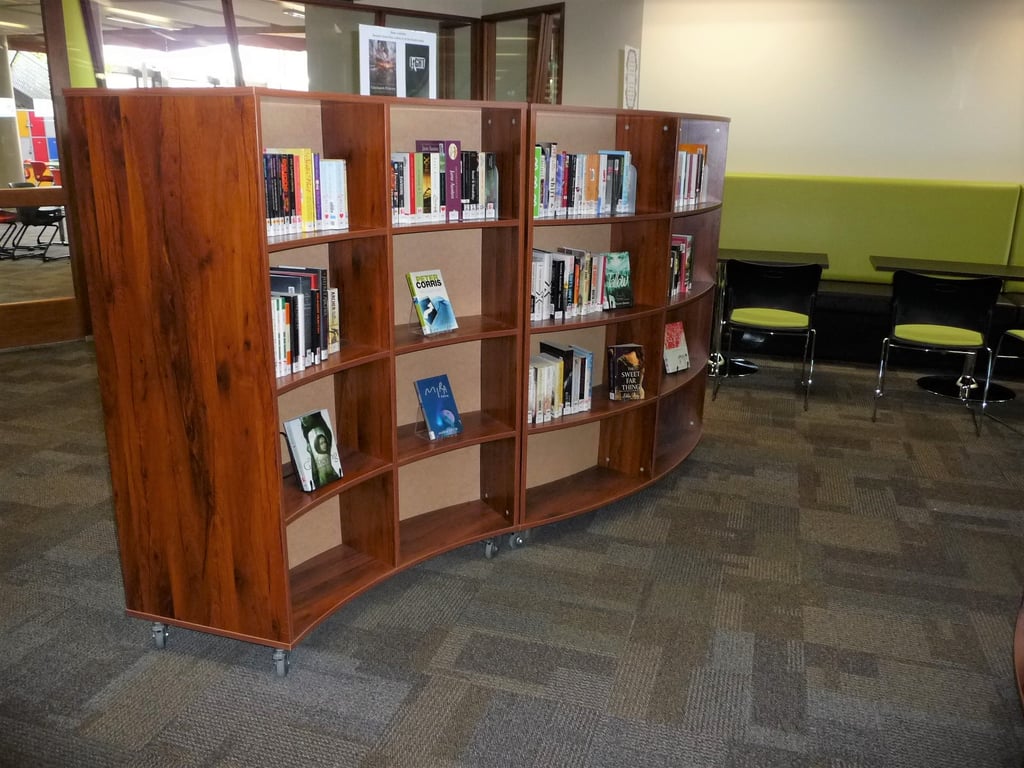 Suzanne Cory HS Library 1.JPG Image of Shelving Library IntraSpace Wave 4Tier