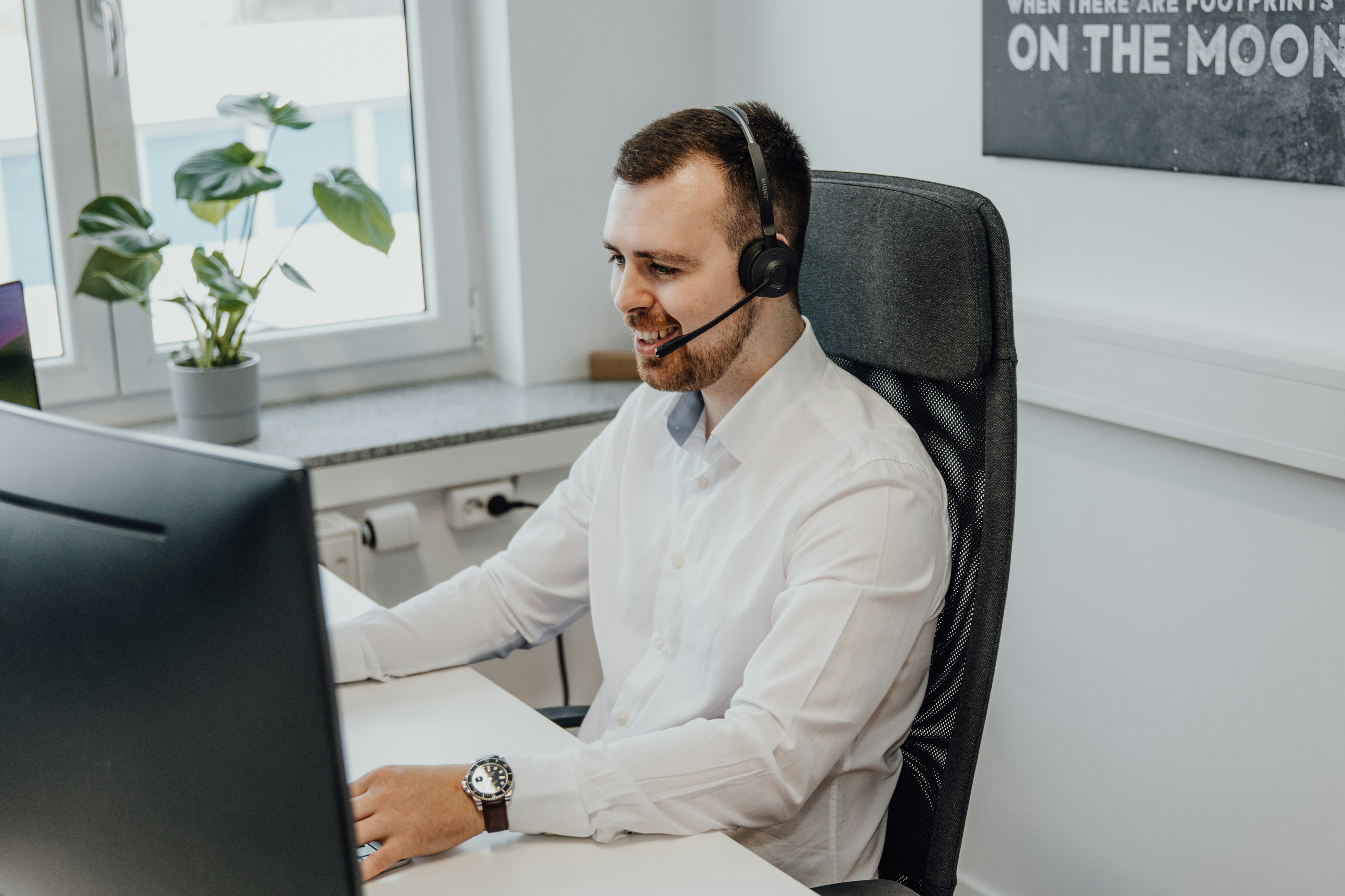 Technical and Marketing Support for BIM Content Creation Services Customer support professional with a headset providing technical and marketing support, including BIM content creation, BIM library updates and engagement strategy resources.