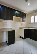 Prime Location: Unfurnished 2BHK Steps From Metro Access - Apartment in Al Mansoura