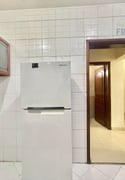 City Living: Furnished 2 BHK Gem with Balcony - Apartment in Al Mansoura