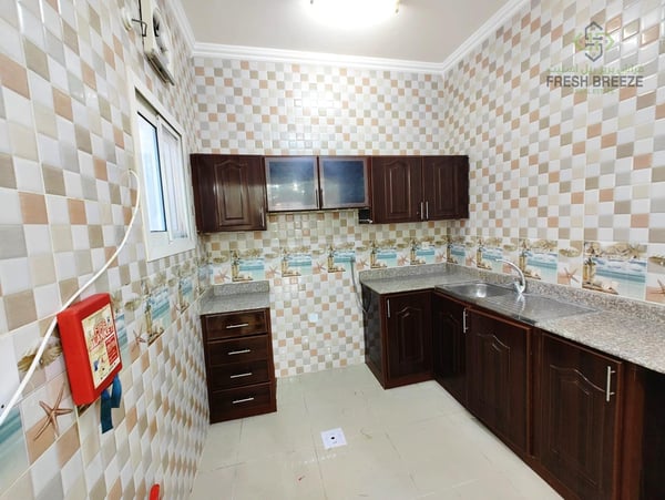 Cozy 2BHK Fully Unfurnished Apartment for Families - Apartment in Umm Ghuwalina