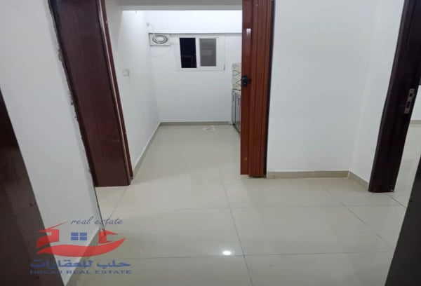 Two large rooms, including a corridor with - Apartment in Al Kharaitiyat