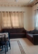 A room and a regular hall inside villa akitchen - Apartment in Salwa Road