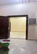 3-bedroom apartment and a living room with - Apartment in Al Gharafa