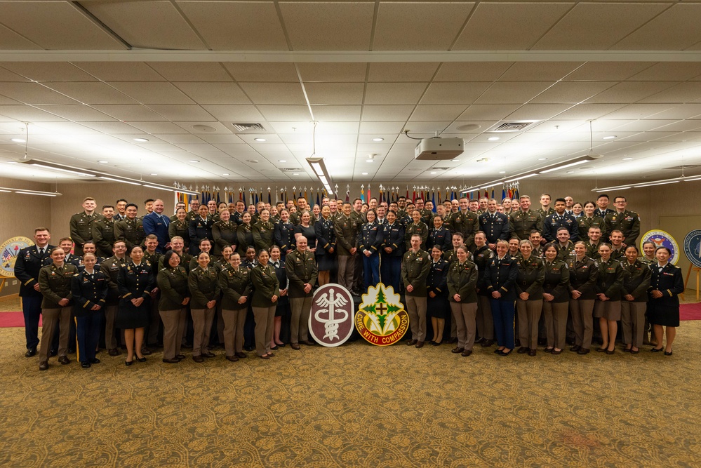 Military physicians at a graduate medical education graduation ceremony