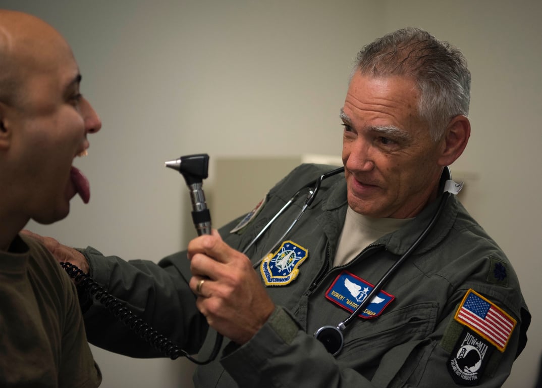 A U.S. Air Force flight surgeon examines a service member during a routine checkup