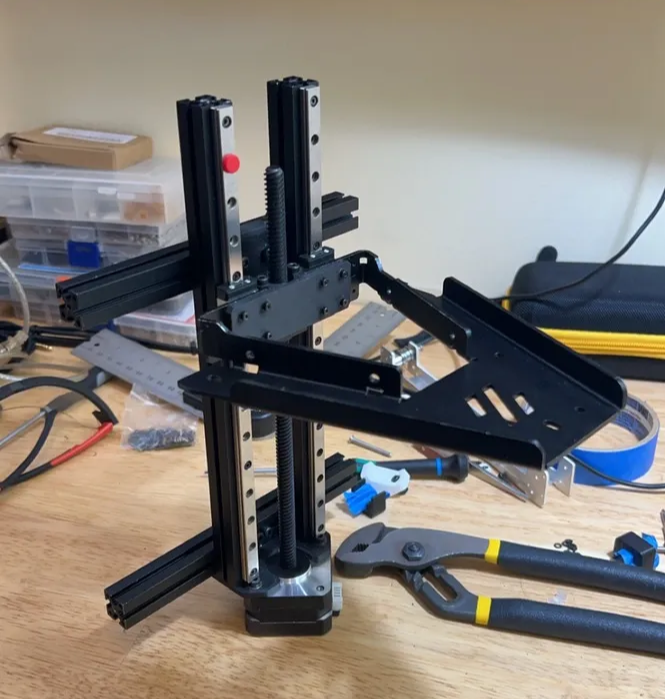 I used a circular saw to cut the aluminum extrusions, and pre-assembled the bed motion system