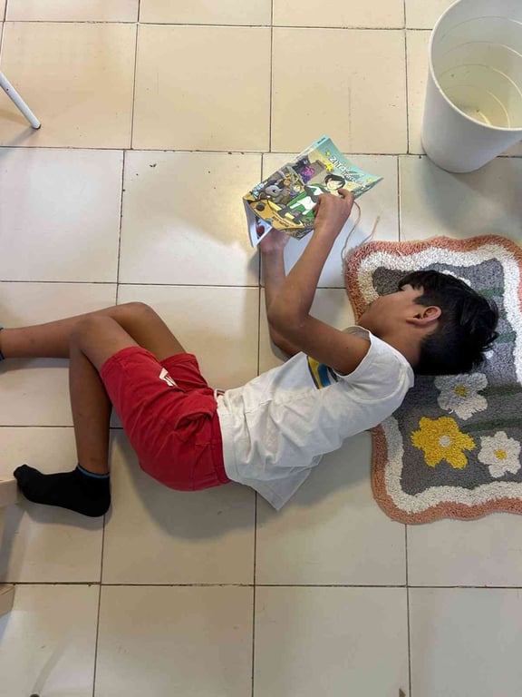 Reading graphic novels on a door-mat. Because who cares!