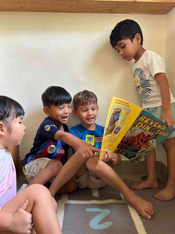 Reading to each other even if we can't quite read yet!