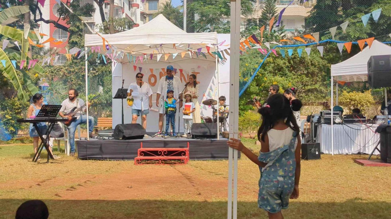 Watching the Comini Collective - a merry band of parents and kids - perform at our first FleaPlay in Jan 25