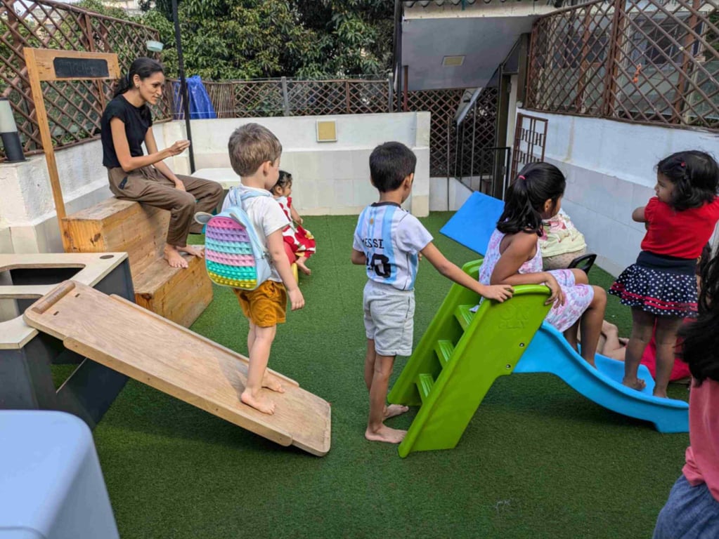 A facilitator observing the obstacle course created by the kids
