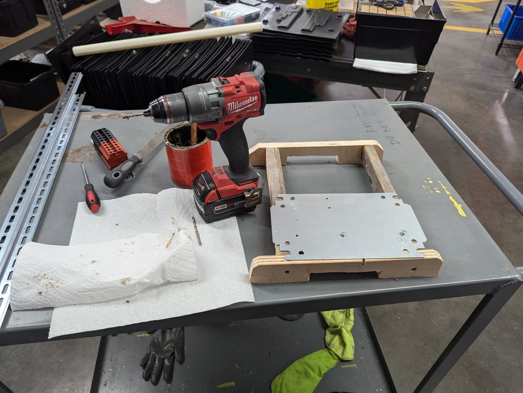 Drilling and tapping holes for the junction box components.