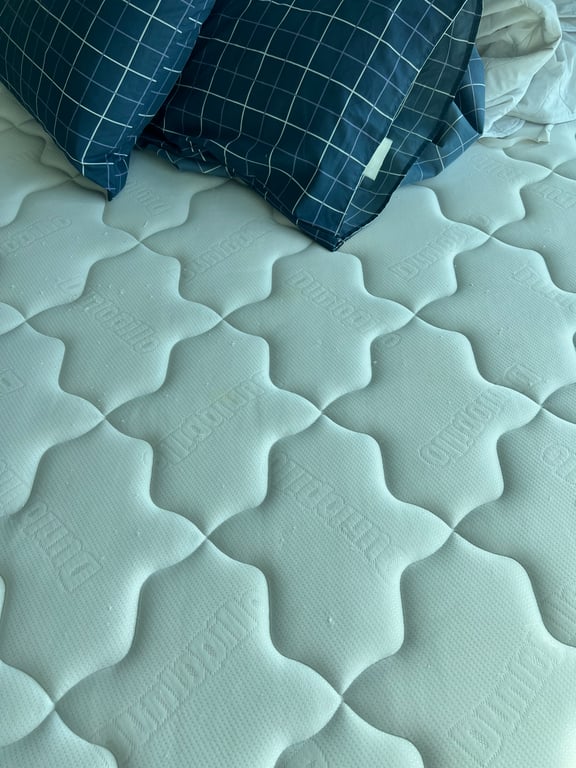 There are some yellow stains on the mattress.