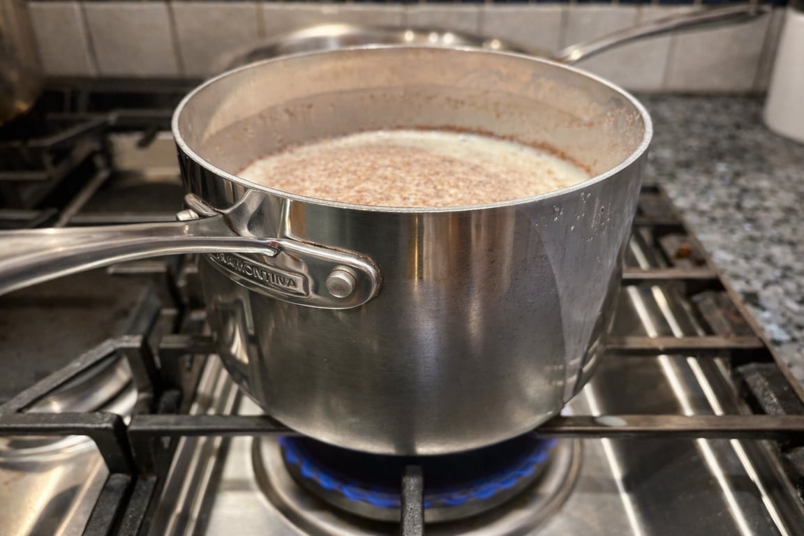 Heat the milk to about 165°F, whisking frequently. Do not let it boil or the mixture will foam and spill over.