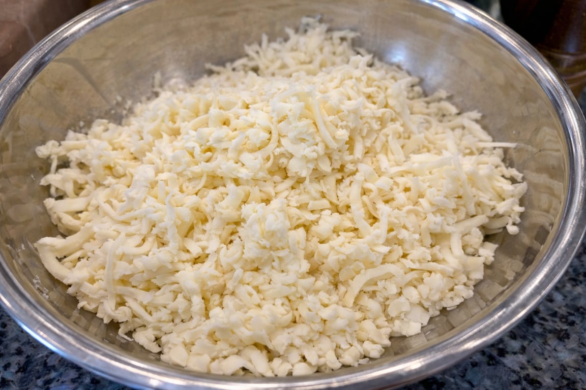 Low-moisture mozzarella only. Fresh mozzarella seems tempting, but it will water down the lasagna.