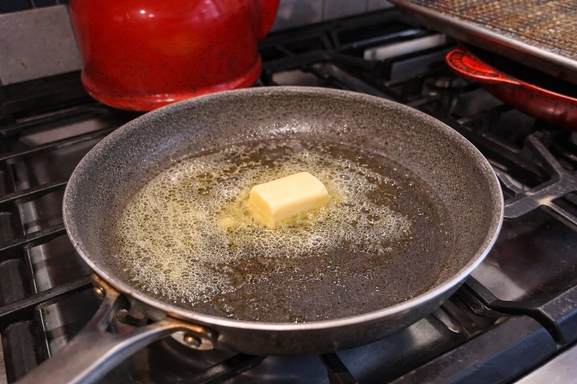 Creamy scrambled eggs come from restraint—a preheated pan and a steady medium flame.