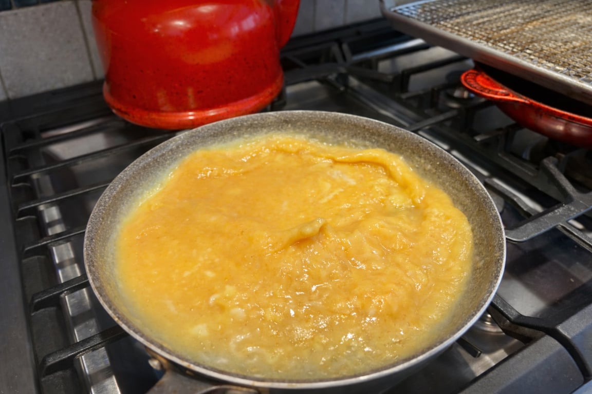 Shaking the pan back-and-forth builds air before the eggs begin to set.