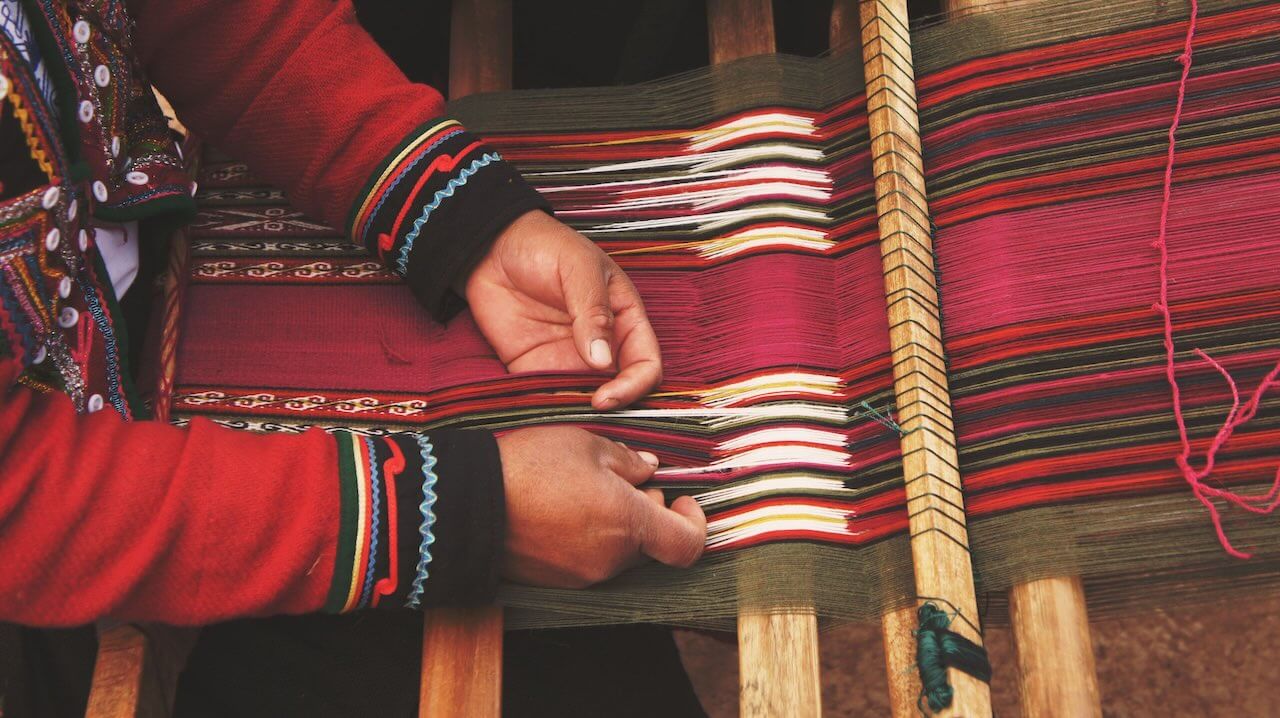 Weaving with a loom: a useful tool, but requiring a lot of skill and patience.
