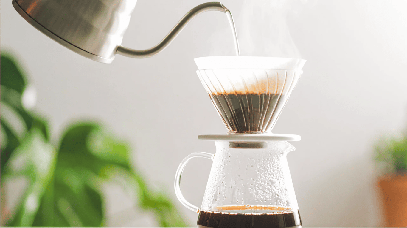 A pour-over coffee being carefully brewed, reflecting the deliberate, craft-driven methodology of Pillar & Press Studio