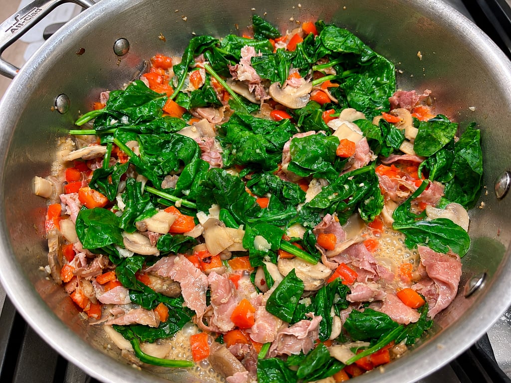 The spinach only needs a minute. Keep it green.